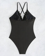 Solid-color one-piece swimsuit with cutouts