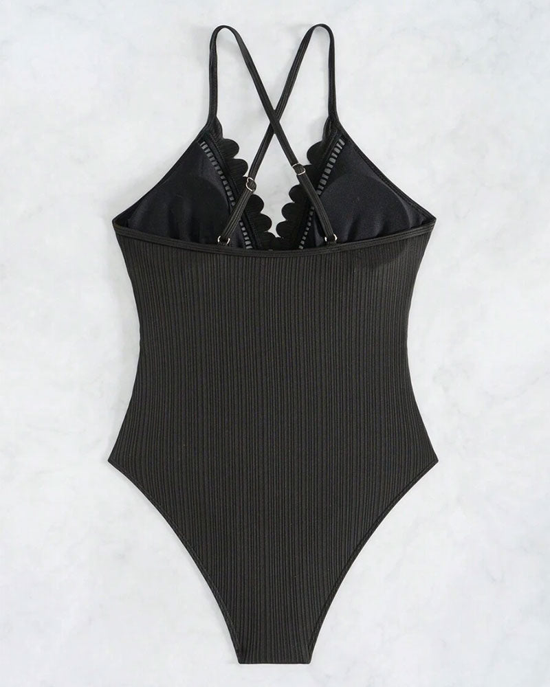 Solid-color one-piece swimsuit with cutouts