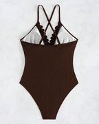 Solid-color one-piece swimsuit with cutouts