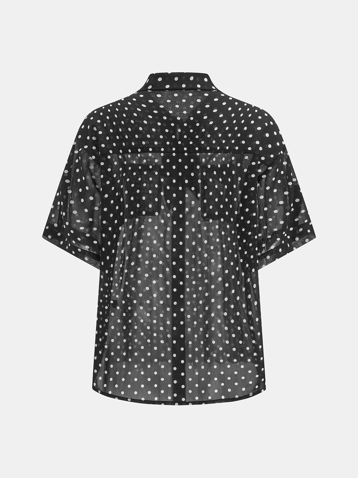 Conjunto de camisa transparente y minifalda de lunares